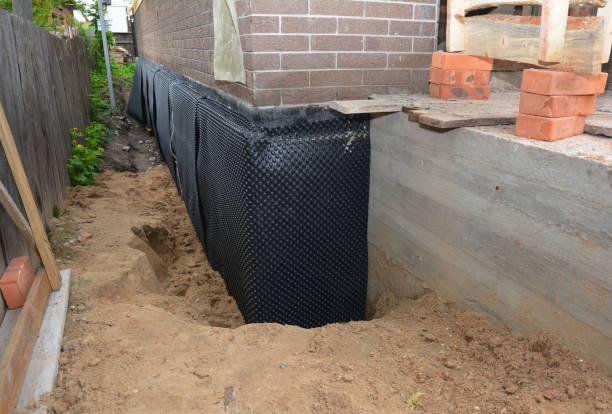 SJ Waterproofing Pros technician performing targeted Basement Waterproofing assessment in Midway, KY